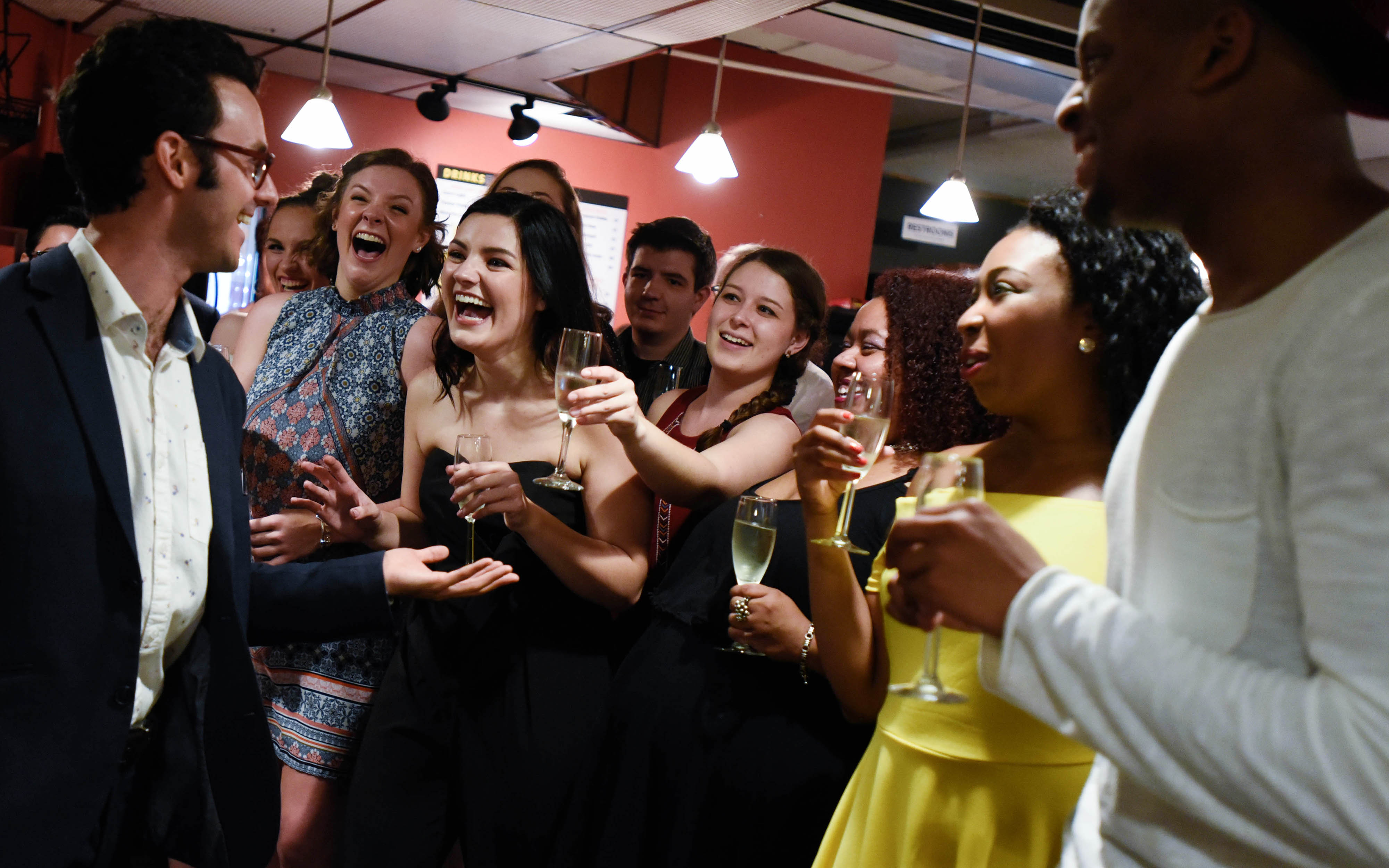 Mamma Mia! cast and crew members gather for a champagne toast after the show on the opening night of Mamma Mia! at theREP in Albany Tuesday, July 11, 2017.